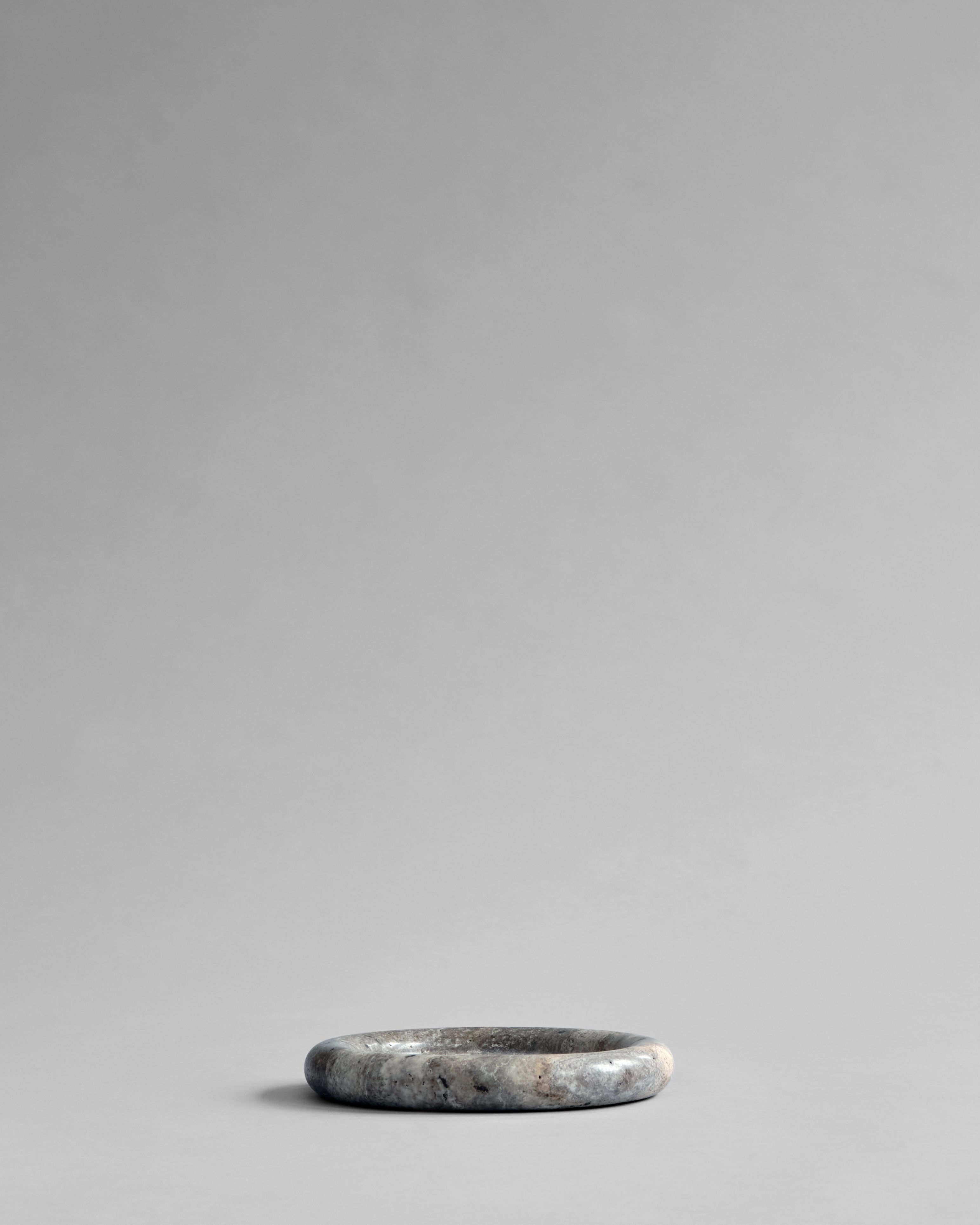 Side view showing profile of Enkei Tray, Mini in Earth travertine – 101 Copenhagen.