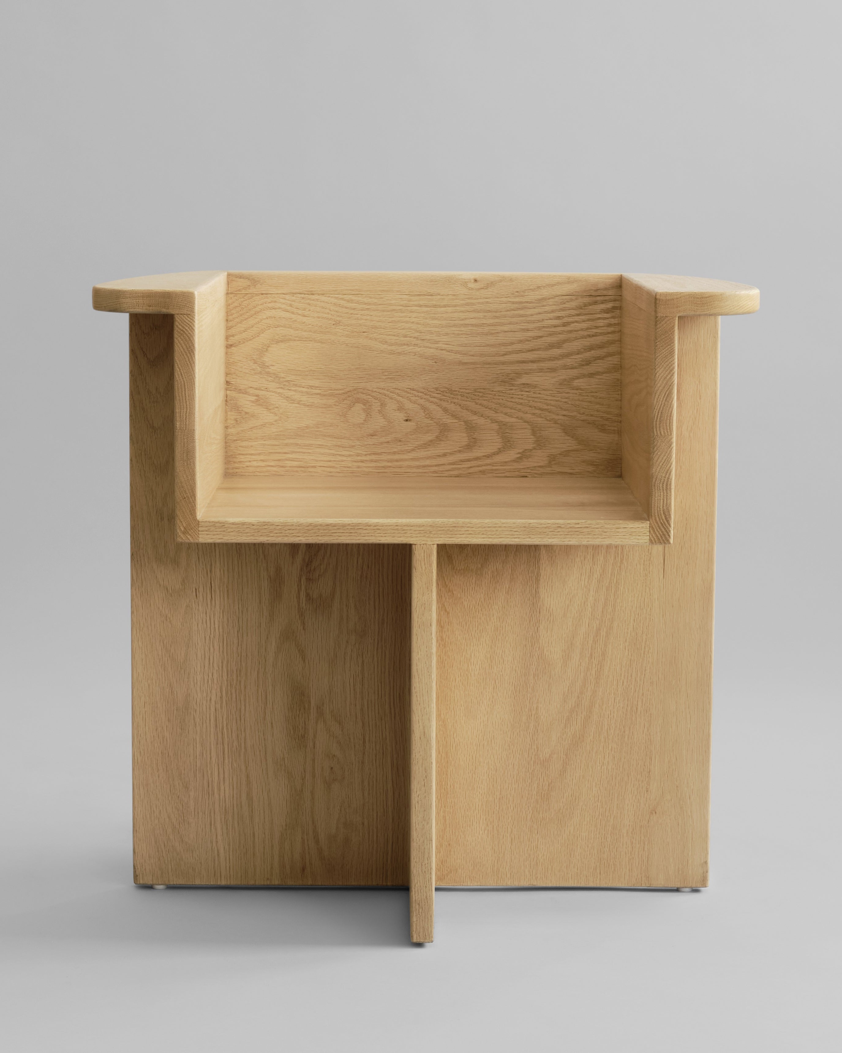 Wooden desk with a minimalist design on a gray background. 101 Copenhagen Brutus Dining Chair, Curated by Numa Home
