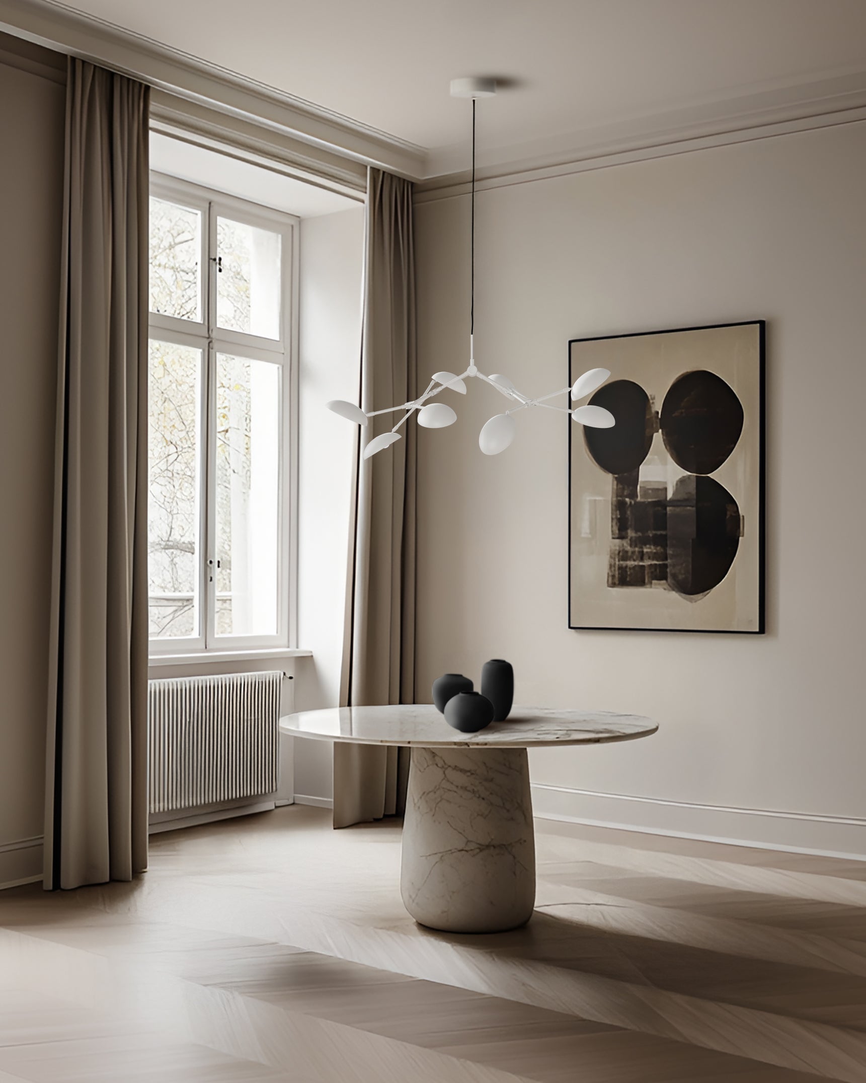 Modern interior with a marble table, abstract art, and large window.