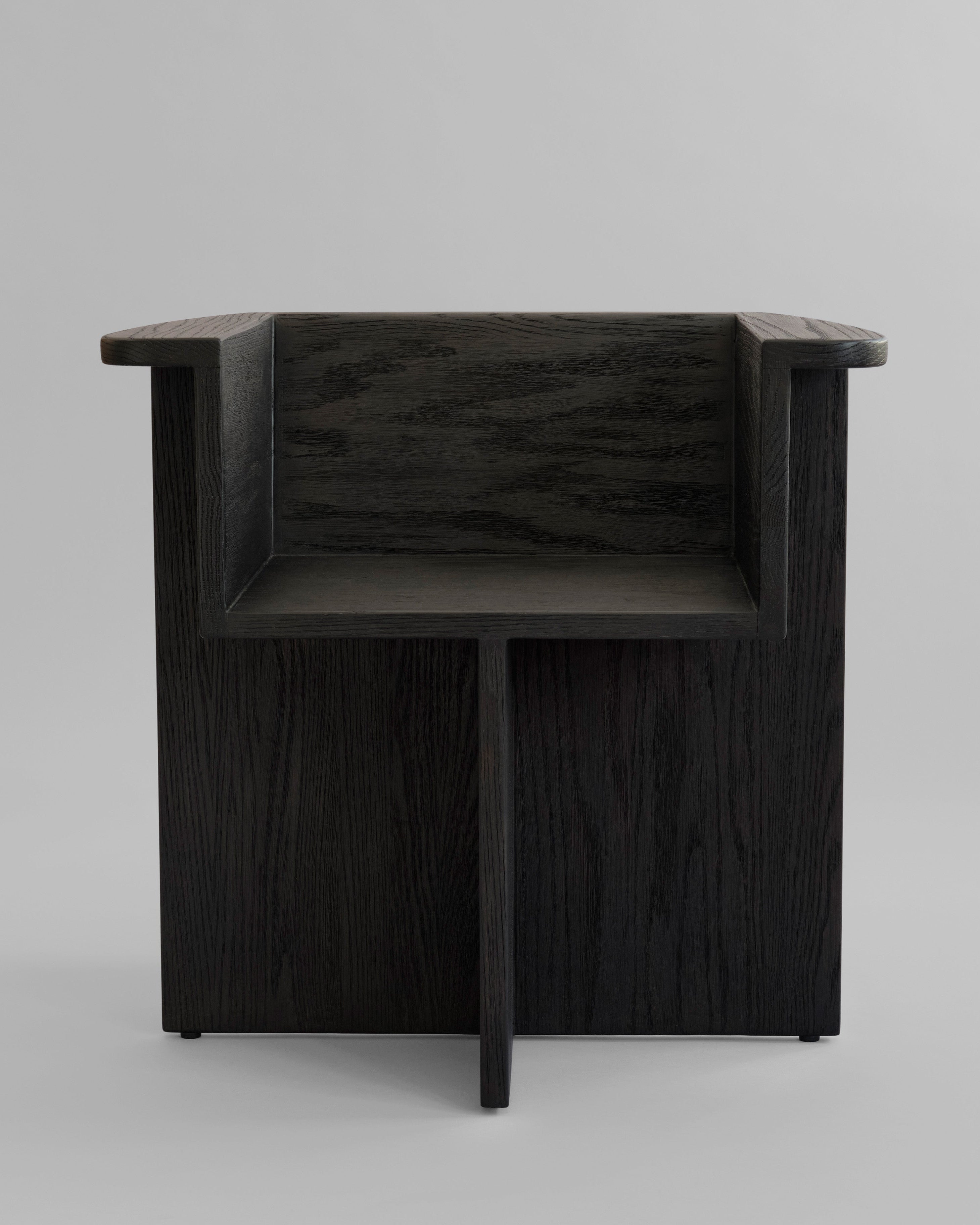 Dark coffee oak dining chair on a light gray background. 101 Copenhagen Brutus Dining Chair, Curated by Numa Home