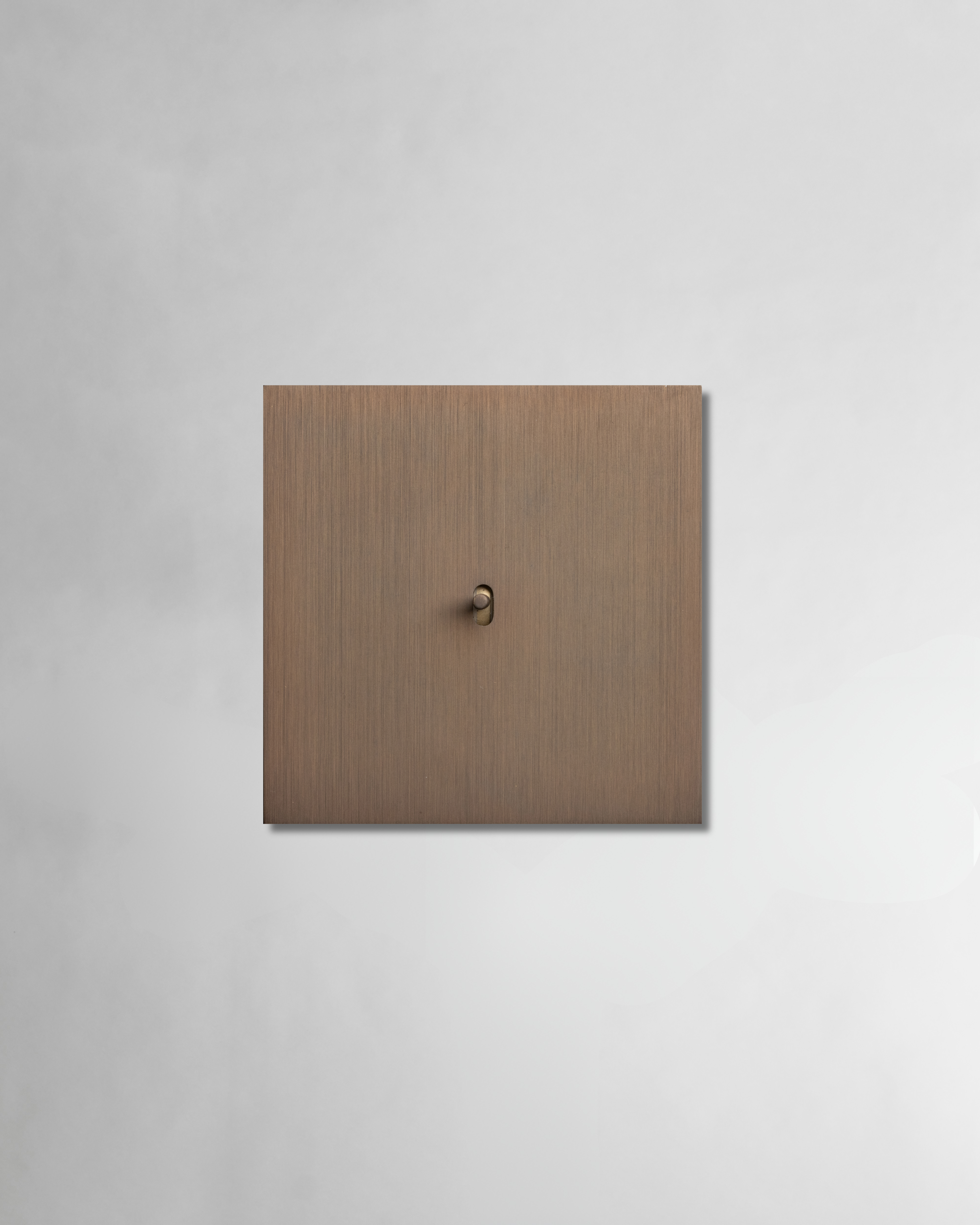 Brass electrical single switch for high end projects in brushed antique bronze finish both for smart and classic wired systems