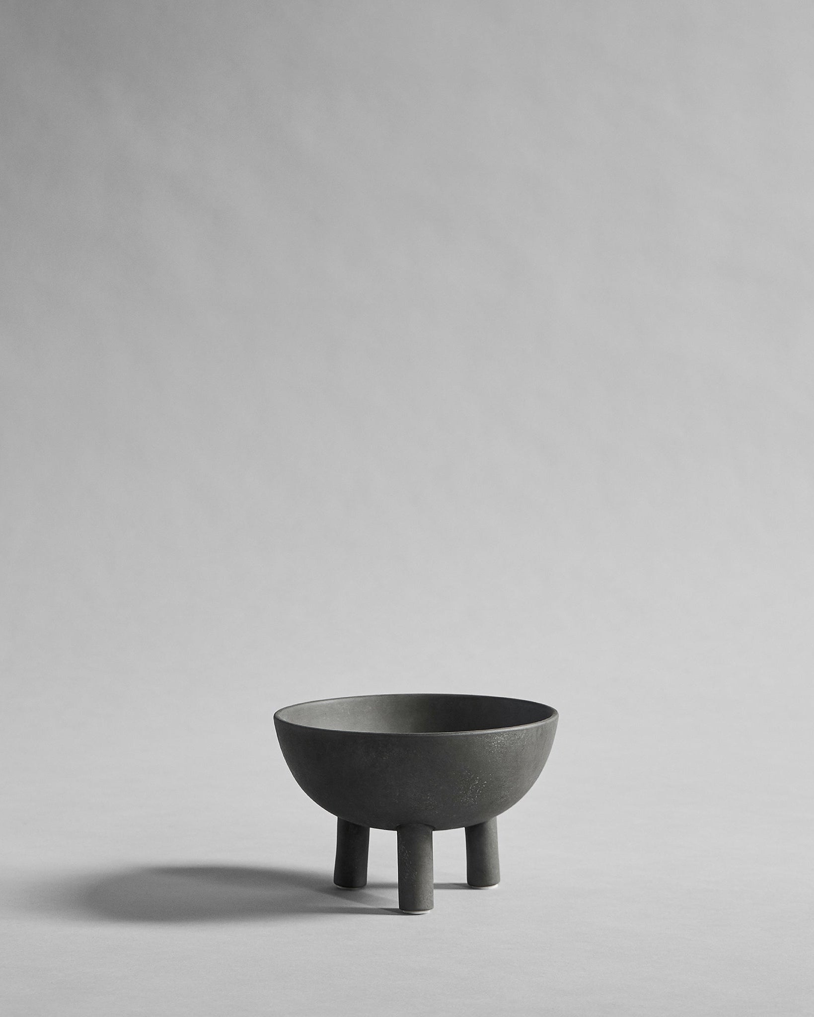 Gray ceramic bowl on a light gray background