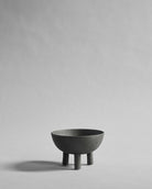 Gray ceramic bowl on a light gray background