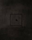 MATA recessed switch with a single bullet-shaped button, seamlessly integrated into a dark textured plaster wall – Sumum x Studio STRAF. Curated by Numa Home for the Netherlands and Turkey