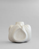 White ceramic vase on a gray background