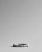 Side view showing profile of Enkei Tray, Mini in Earth travertine – 101 Copenhagen.