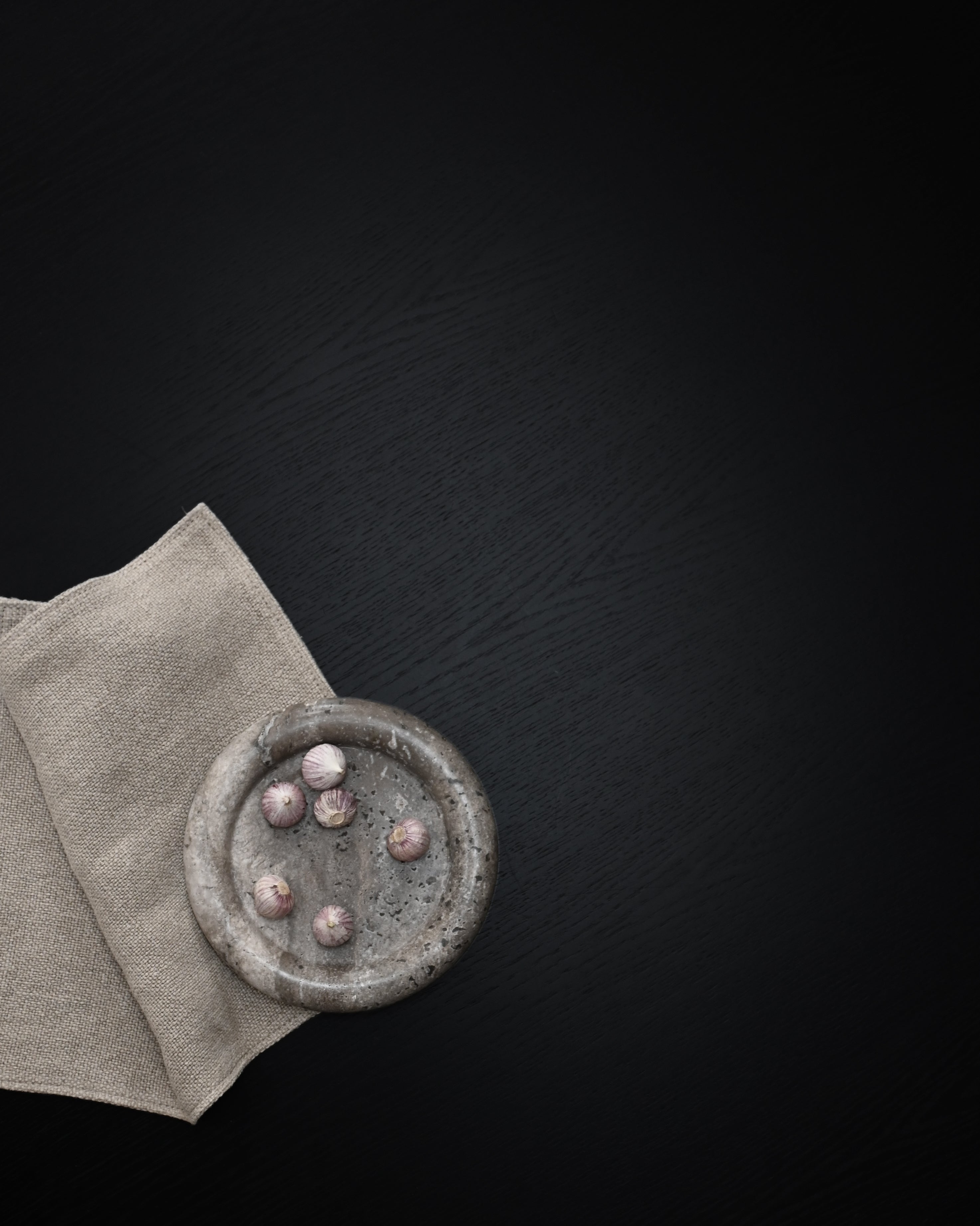 Enkei Tray, Mini styled on a tabletop in Earth travertine – 101 Copenhagen.
