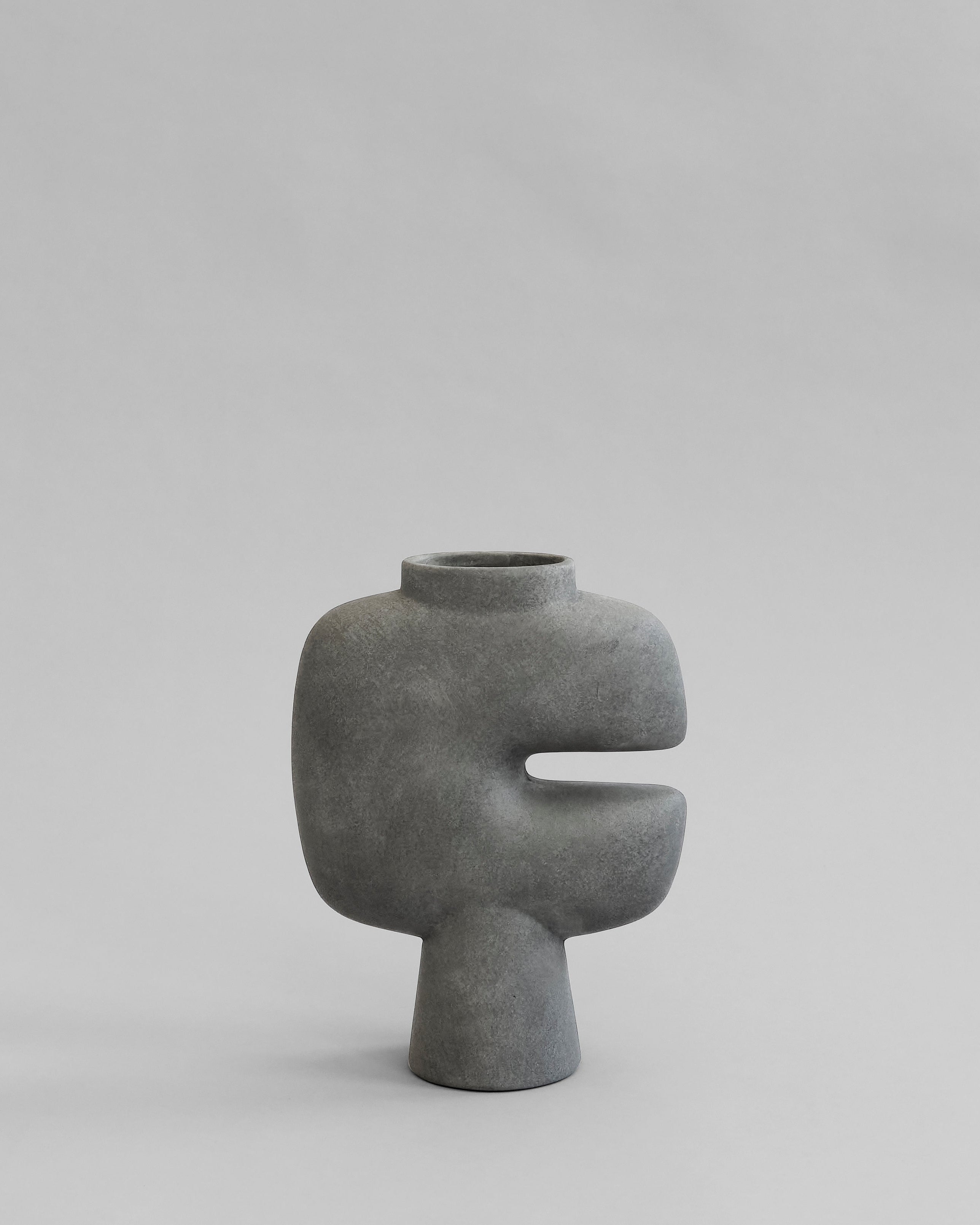 Gray abstract vase on a light gray background