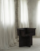 Modern black dining chair in front of white curtains.  101 Copenhagen Brutus Dining Chair, Curated by Numa Home