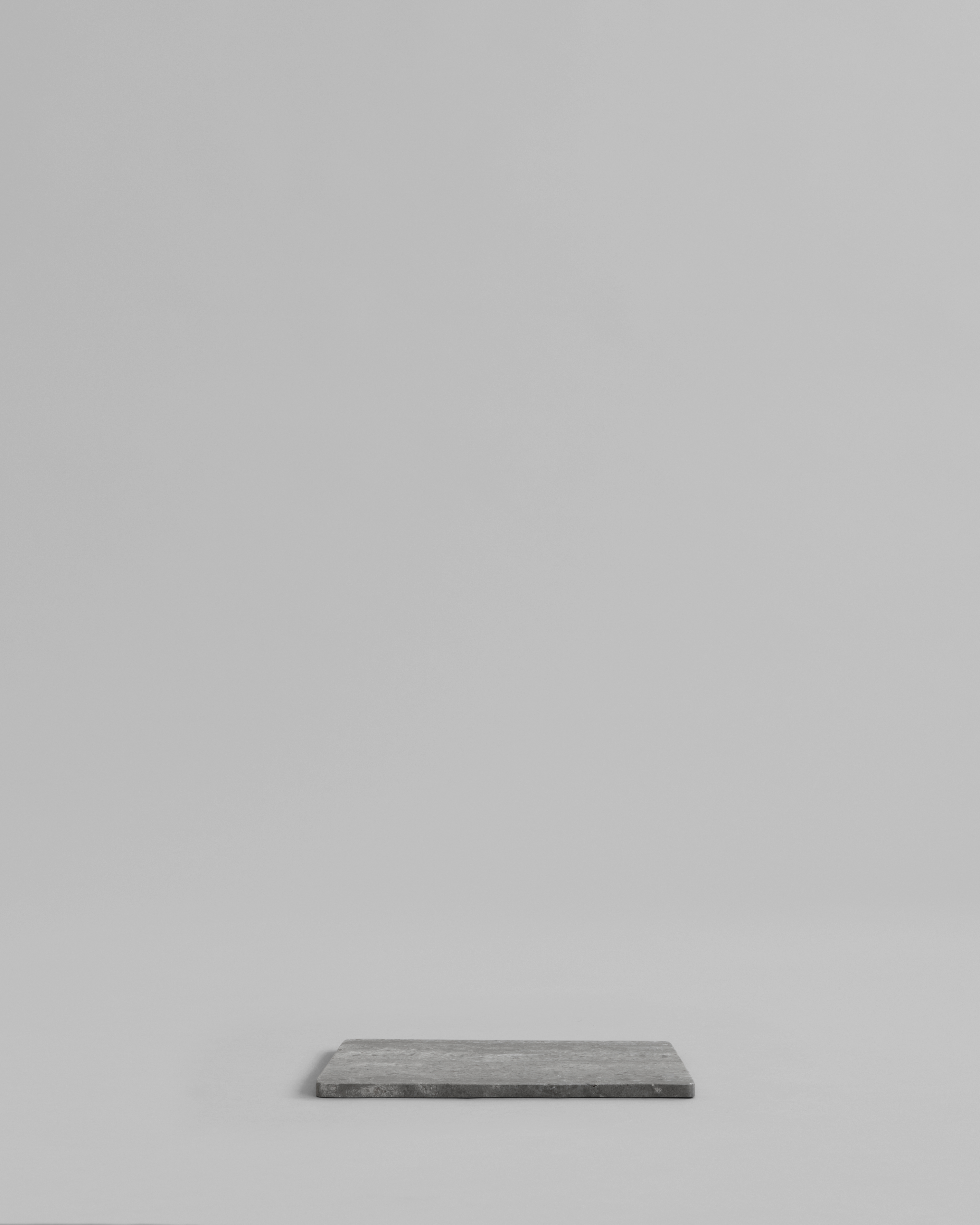 Side view showing slim profile of Enkei Tray Rectangular, Petit – Silver Travertine, 101 Copenhagen.