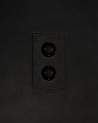MATA recessed double power outlet with two sockets set in a dark textured plaster wall – Sumum x Studio STRAF. This socket is curated by Numa Home for the Netherlands and Türkiye.