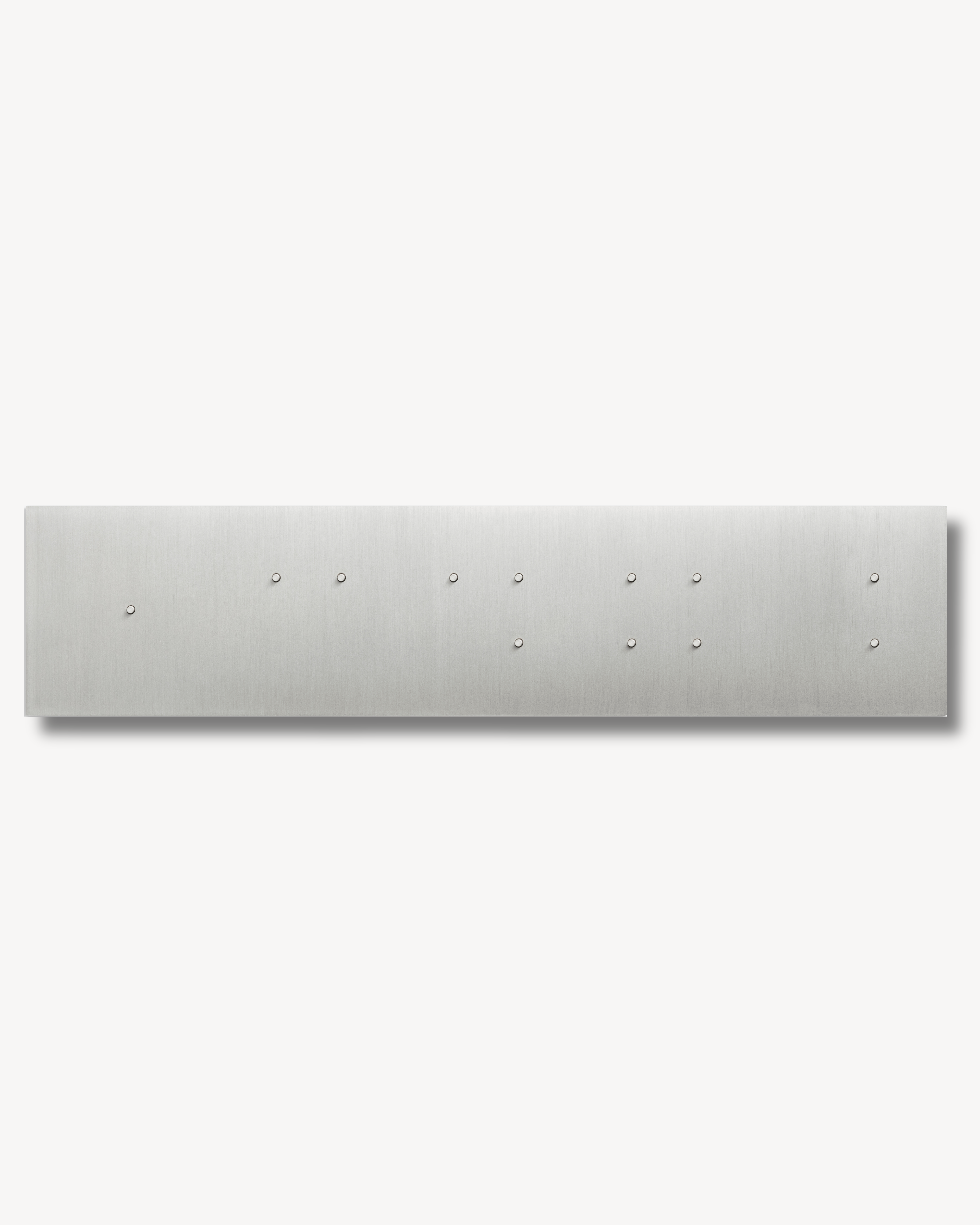 Rectangular Brass switch with mind blowing 12 buttons on it. Looks like a piece or art or jewelery. Sumum PIN switch curated by Numa Home istributed to Turkey and Netherlands.