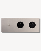 Brushed metal finished brass electrical switch plate with 3 units. Single oush button and double outlets.