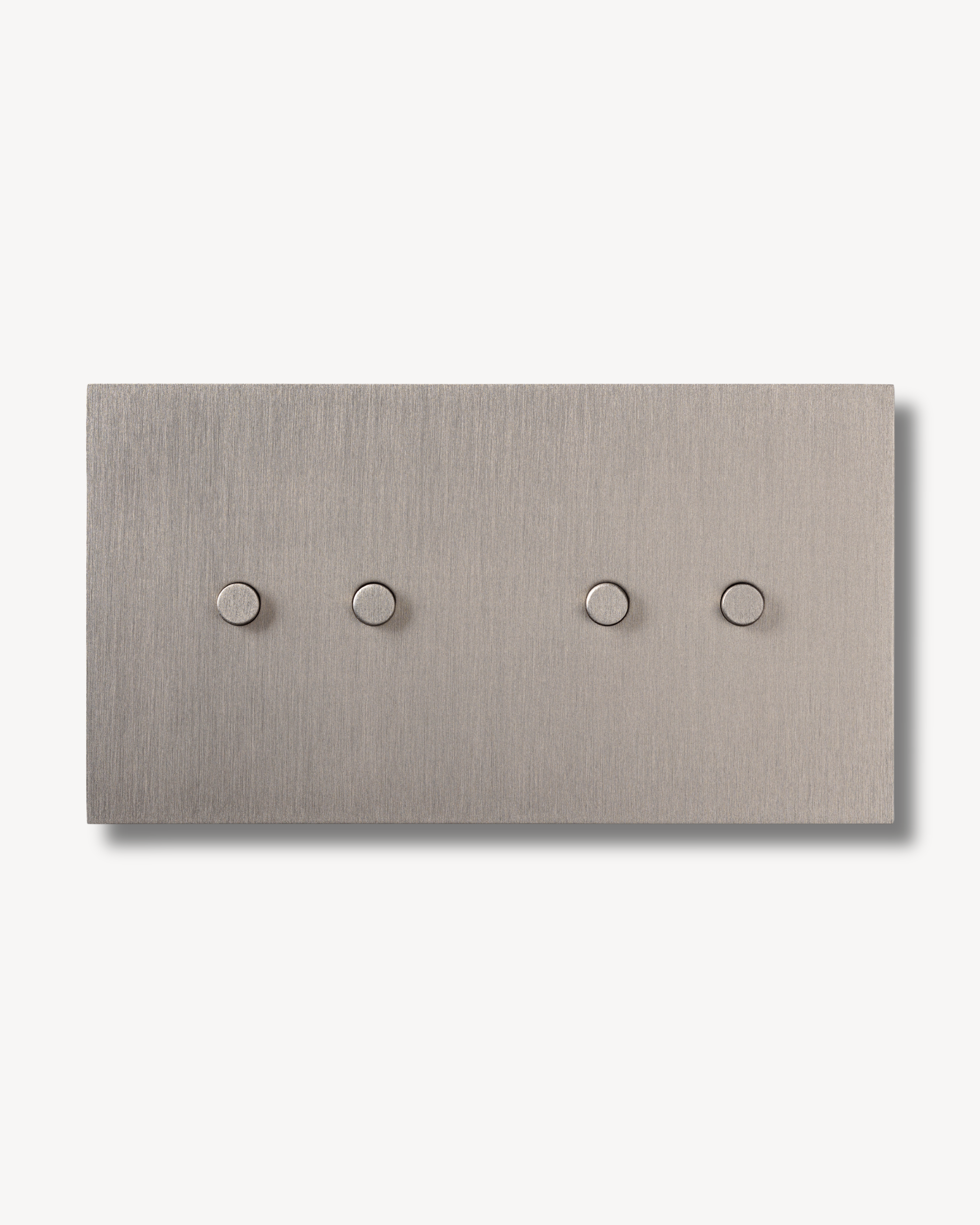 Brushed Nickel rectangular switch plate made of brass with four silver round knobs on a white background. Suitable for smart homes and conventional wiring.