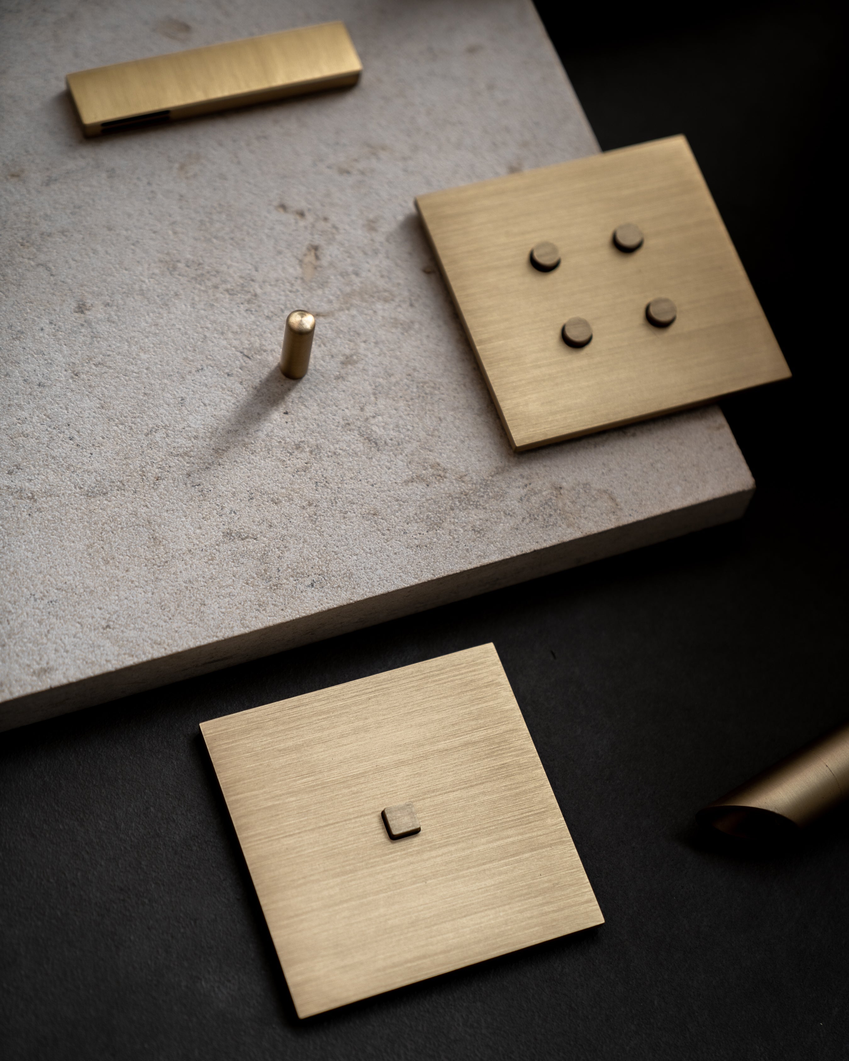 All Sumum products in brushed brass finish. CO2 and temperature sensor cover, round brass switch with 4 buttons and square brass switch with single push button and a reading light.