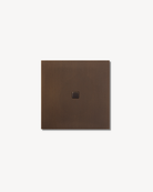 Sumum Square single-button brass switch in antique bronze (brass patina) finish, handcrafted custom light switch for luxury interior provided by Numa Home