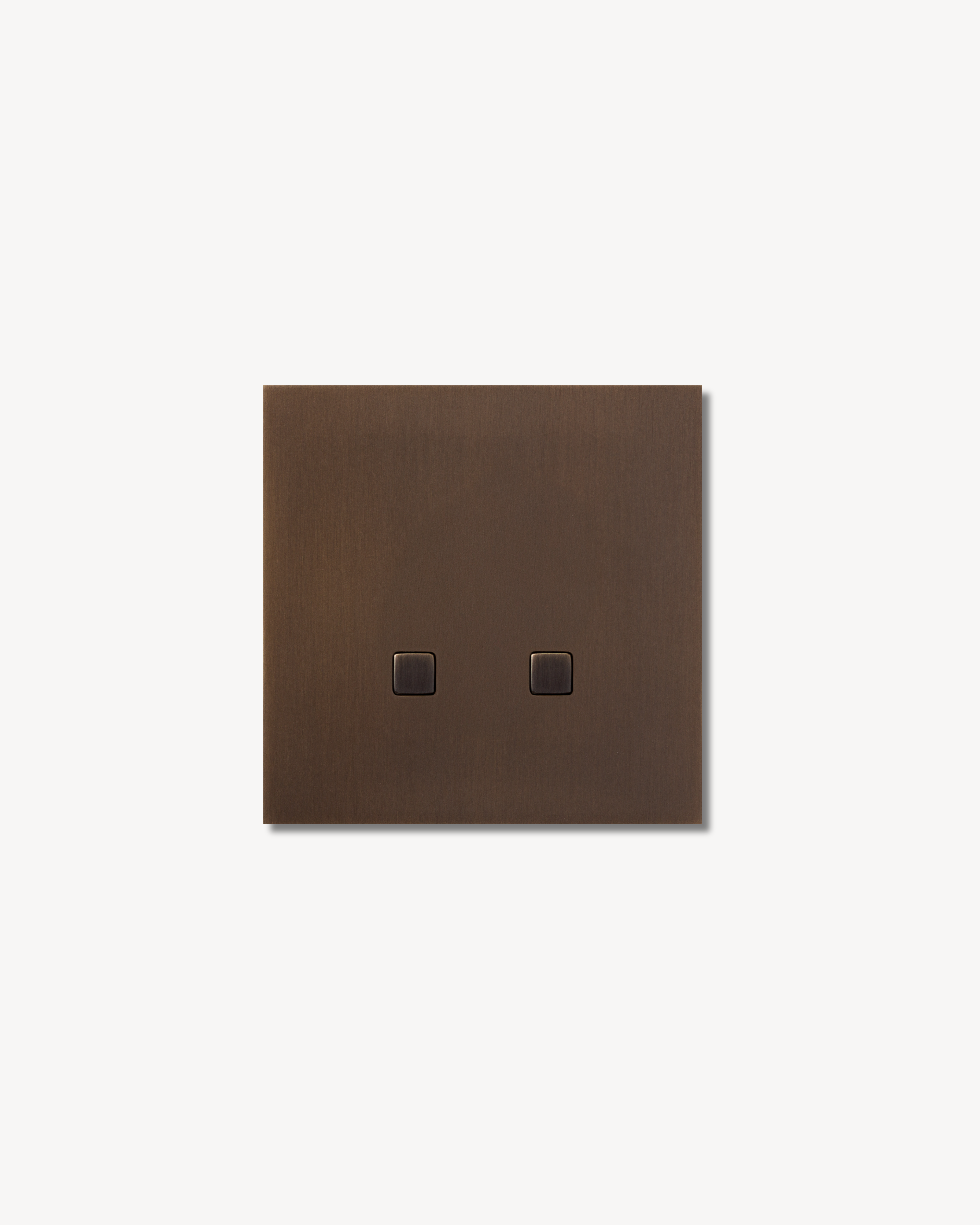 Sumum Square double-button brass switch in antique bronze (brass patina) finish premium custom light switch for high-end Dutch interiors provided by Numa Home